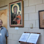 Icon artist Roger Simon poses with some of his works in the Cloister Gallery at St. Michael's Cathedral in Springfield.