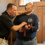 Michael Broer (right), an Office of Worship staff member, participates in Active Shooter training at St. Michael's Cathedral in Springfield.