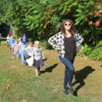 Miss Applebee leads preschoolers at the St. Joan of Arc School Walk-a-Thon held recently at Ray Ash Park, Chicopee.