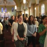 Local teens, who will attend the Nov. 21-23 National Catholic Youth Conference, attend Mass at Our Lady of Mt. Carmel Church in Springfield.